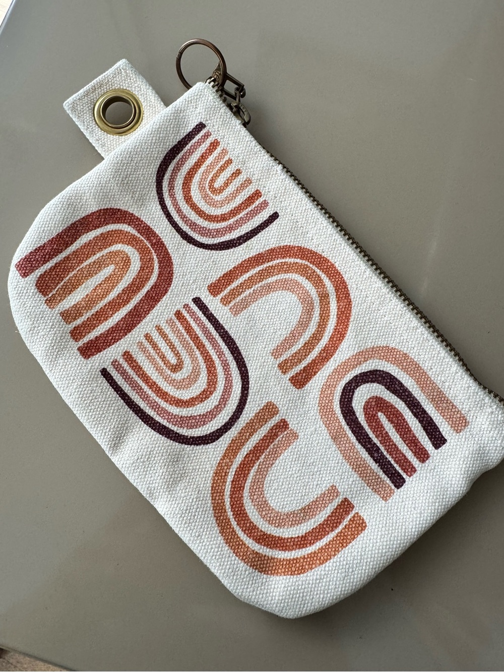 Danica Studio canvas zip pouch with terracotta rainbow screen-print design